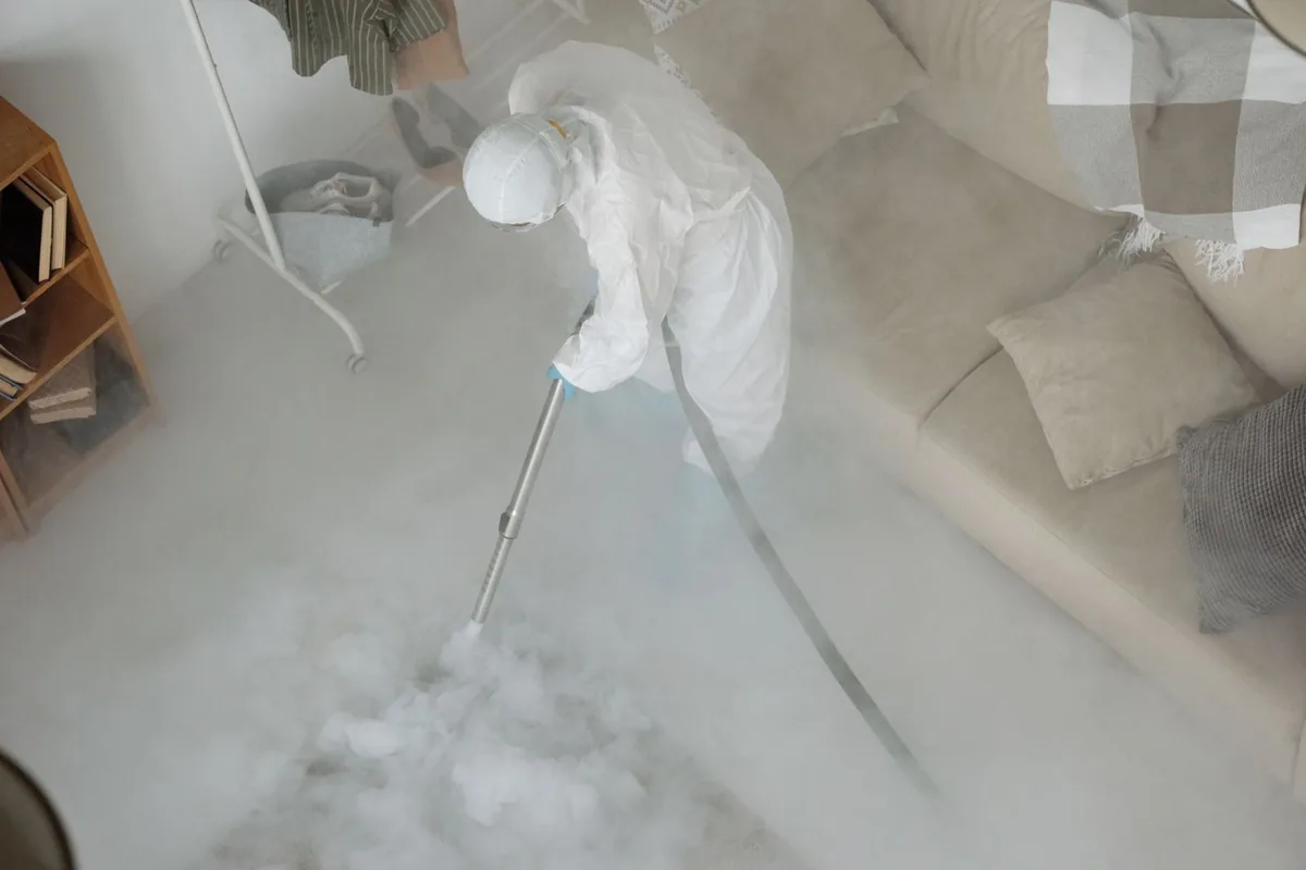 Biohazard cleanup technician in protective equipment, Coupeville, WA